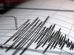 un sismógrafo registrando ondas sísmicas en papel milimetrado